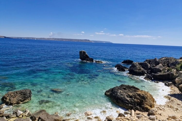 Rocks jutting out into the Mediterranean. Photo by Chris Saunders