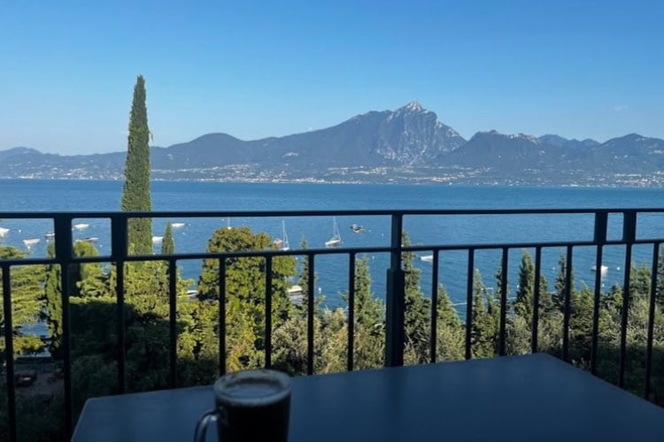 Morning café latte at Residence La Corte Danese with a view of Lake Garda. Photo by Julia Riccardi