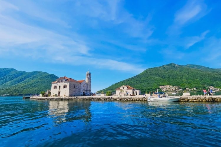 Our Lady of the Rocks is an artificial island built stone by stone by sailors dropping rocks into the bay. Photo by Zuzana Zimmermannova