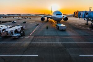 Parked airplane at sunset. Photo by Rocker Sta, Unsplash