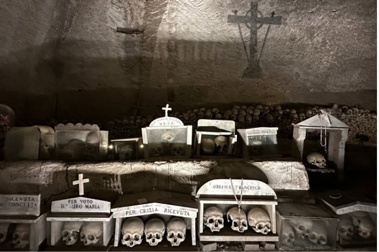 Small tabernacles containing skulls at the Fontanelle cemetery. Photo by Steve Sindiong