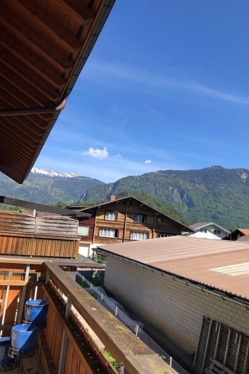Balcony of the apartment overlooking other houses in the same estate. Photo by [Author's Name]