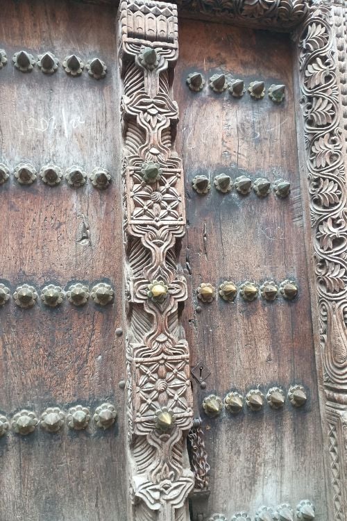 Carved double-wooden doors that grace house entrances are a result of Arab architectural influence