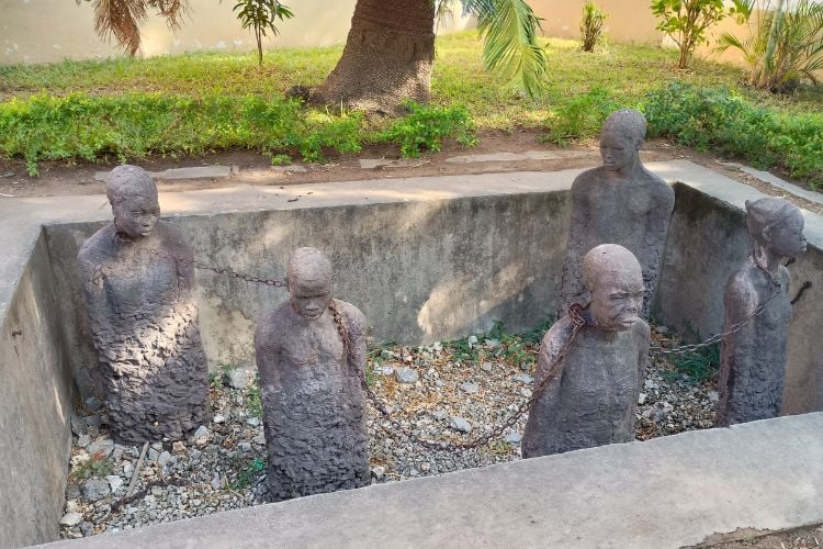 The most dramatic exhibit was a pit filled with chained stone slave statues