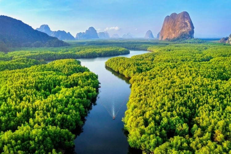 Aerial view of Phang Nga Bay with mountains at sunrise in Thailand. Photo by Getty Images, Unsplash
