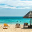 Beach umbrellas in Cancun, Quintana Roo, Mexico. Photo by David Vives, Unsplash