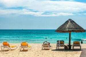 Beach umbrellas in Cancun, Quintana Roo, Mexico. Photo by David Vives, Unsplash