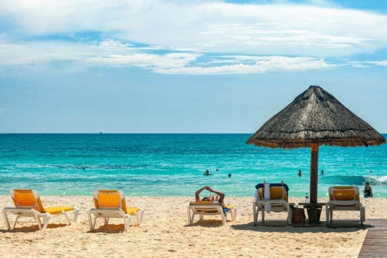 Beach umbrellas in Cancun, Quintana Roo, Mexico. Photo by David Vives, Unsplash