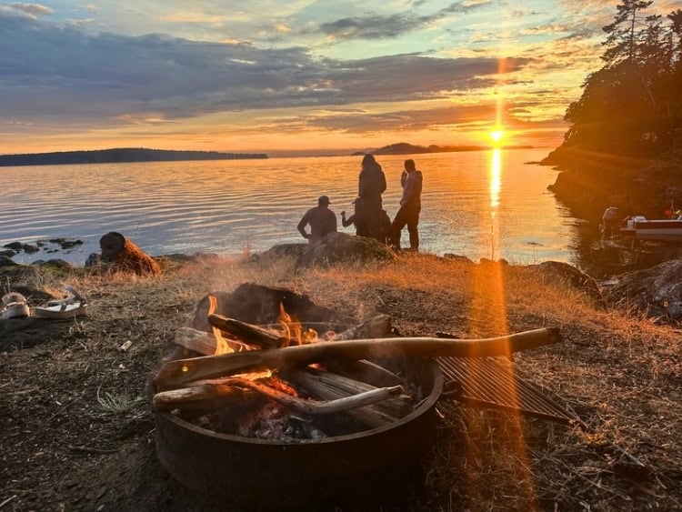Campfire on Jones Island at sunset. Photo by Teresa Bergen