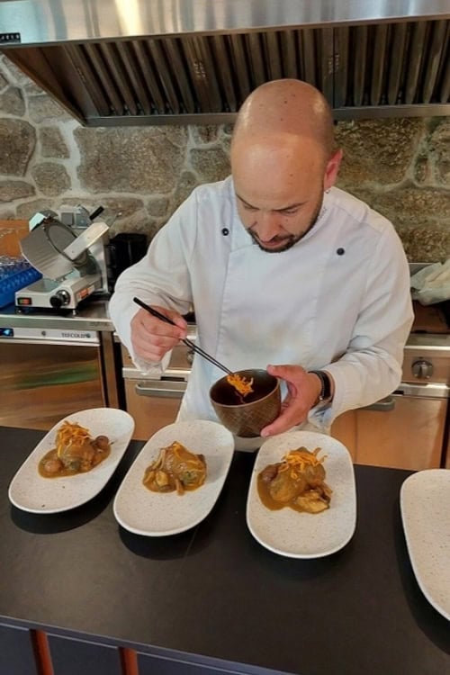 A chef preparing tapas plates for our wine tasting at the Vía Romana winery in the Ribeira Sacra region of Galicia. Photo by Richard Varr
