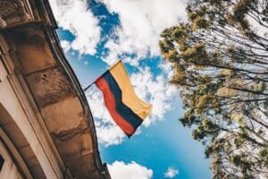 Colombian flag in Downtown Bogotá. Photo by Flavia Carpio, Unsplash