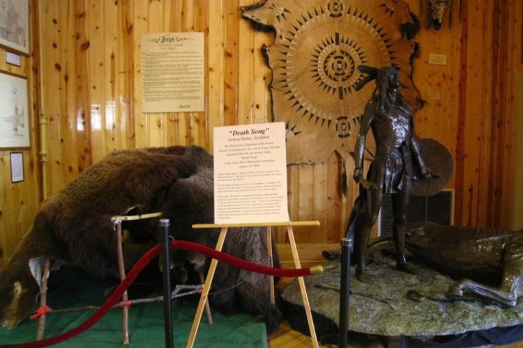 Ernest Berke's 1968 Death Song sculpture at the museum depicting a Western Lakota warrior preparing for battle. Photo by Frank Hosek