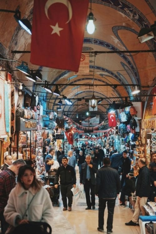 Visitors explore the colorful and bustling Grand Bazaar, Istanbul, Turkey. Photo by Linus Mimietz, Unsplash