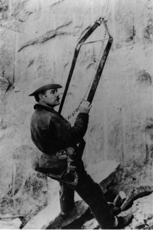 Gutzon Borglum, sculptor of Mount Rushmore, inspects the work on the memorial. Photo courtesy of the U.S. National Park Service