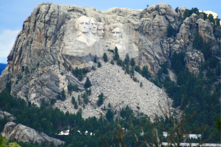 Mount Rushmore in the Black Hills of South Dakota. Each head is 60 feet tall and carved into the granite on the southeast side. Photo by Kathy Hosek