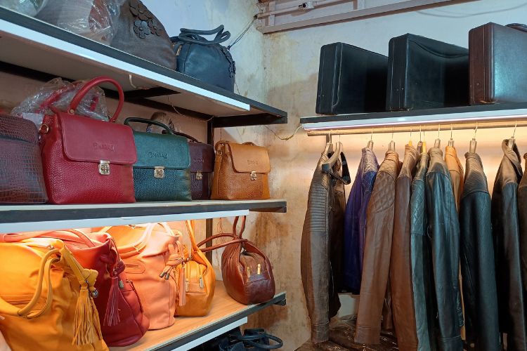 A high-end shop displaying elegant bags and coats 