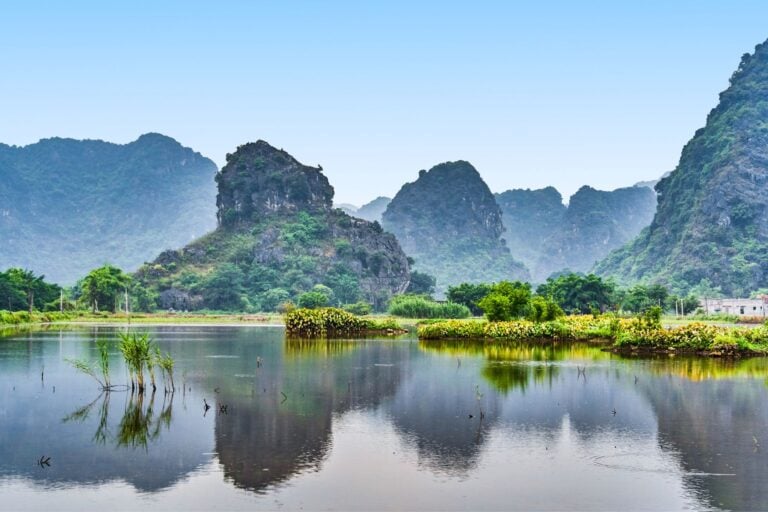 The often overlooked Ninh Binh holds a serene beauty for those who stop. Image by AlexeyPelikh from Getty Images via Canva
