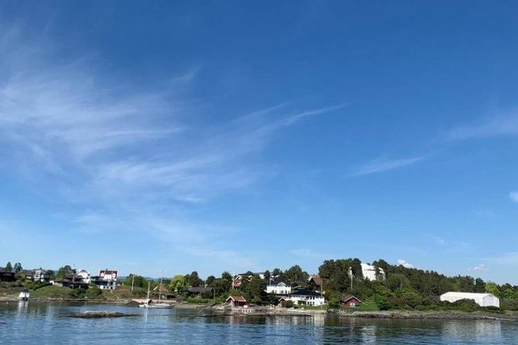 Colourful, cute waterfront homes on one of the scenic islands of the Oslo Fjord. Photo by Ratna Singh