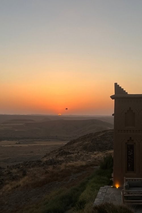 Sunset transforms the rocky hills of Morocco's Agafay Desert into shades of gold and amber. Photo by Natasha Soares