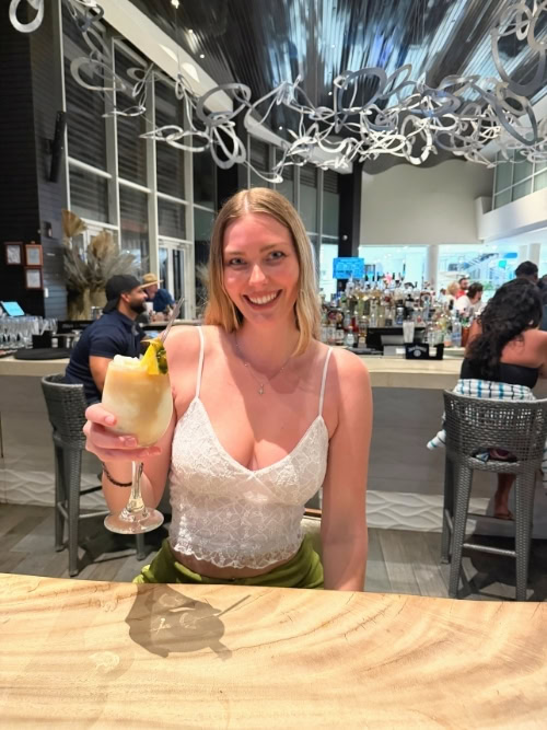 The author, piña colada in hand, at Caribar, right where it all began. Photo by Lauryn Pfrommer-Pease