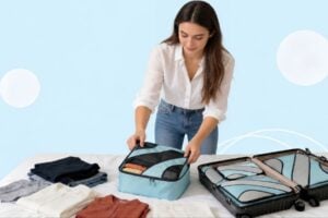 Traveler organizing clothing with BAGAIL packing cubes. Photo courtesy of BAGAIL