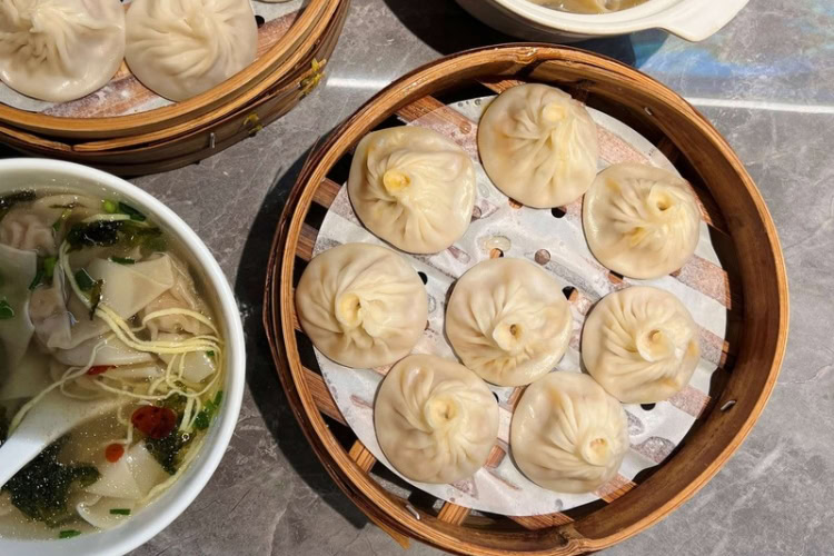 Trying Xiao Long Bao. Photo by Huyen Tran