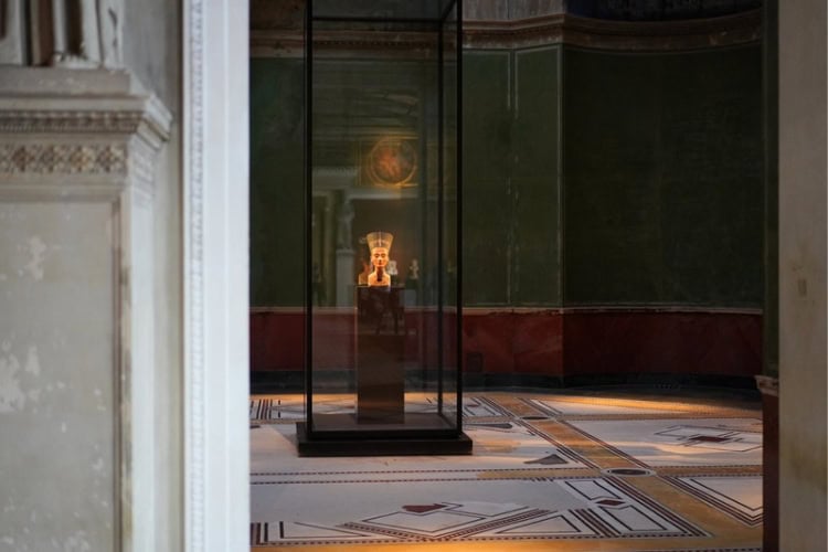 A glimpse of the famous Bust of Nefertiti at Neues Museum, Berlin. Photo by Adobe Stock