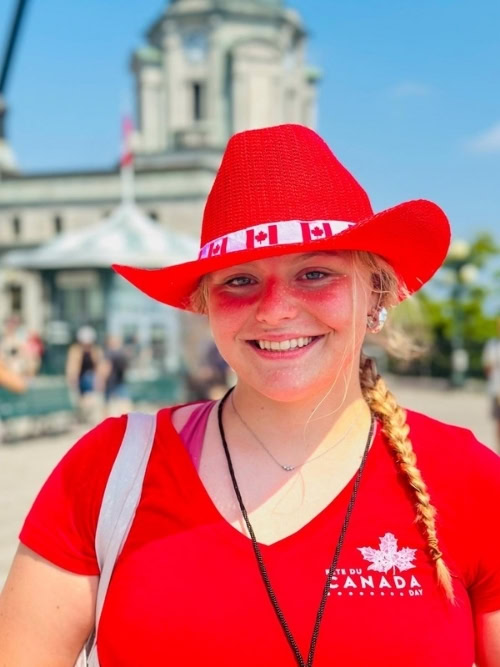 An ambassador at Canada Day festivities in Québec City welcomes visitors. Photo by Sherry Spitsnaugle