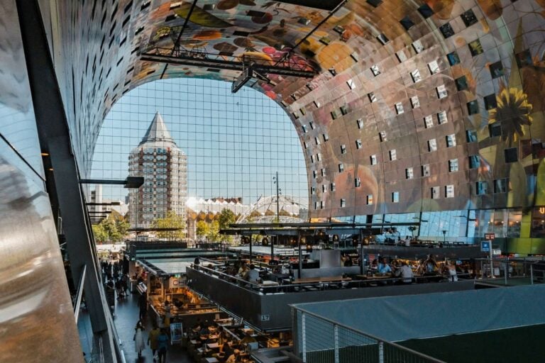 Markthal Rotterdam with restaurants inside Foodhallen, Rotterdam, Netherlands. Photo by Mike van den Bos, Unsplash