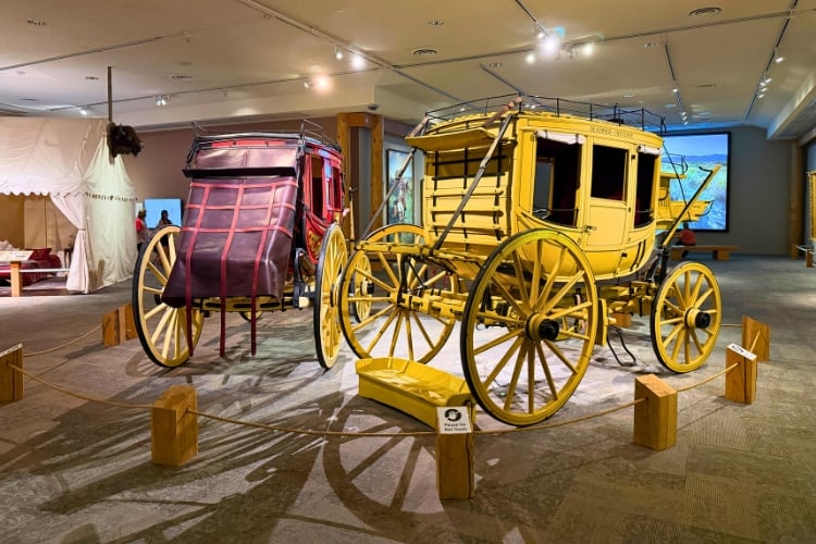 Original stagecoaches on display at the Buffalo Bill Center of the West, part of the museum's look at travel and transportation across the American West. Photo by Isabella Miller