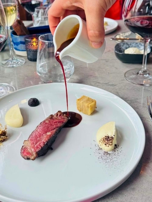 Dinner is served at Champlain, the fine dining restaurant at Fairmont Le Château Frontenac, showcasing local ingredients and impeccable service. Photo by Sherry Spitsnaugle
