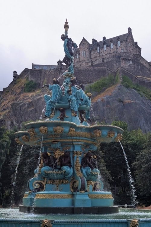 The Ross Fountain in Princes Street Gardens, with Edinburgh Castle rising above the city. Photo by Keri G