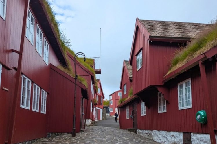 The red, turf-roofed buildings of Tinganes in Tórshavn, Faroe Islands, form the historic government quarter. Photo by Keri G