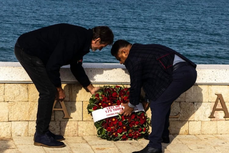 Turkish and New Zealand representatives present a wreath to honor the fallen from both sides during a Remembrance Day ceremony. Photo by Marni Patterson