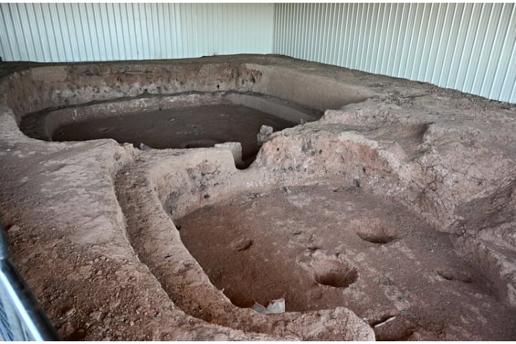 Ruins of the earliest dug-out house from 650 CE, showcasing pre-masonry architecture. Photo by Tab Hauser