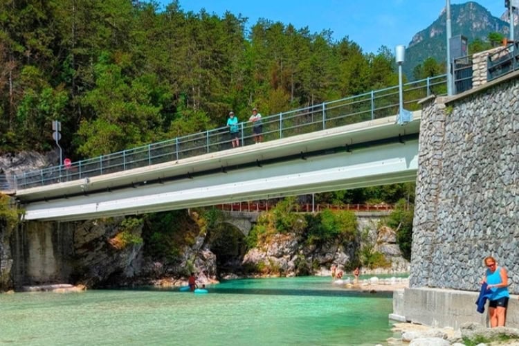 Aquamarine blue river in Italy, the result of limestone particles from the Julian Alps. Photo by Craig Stoltz