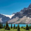 Take a trip through the magnificent Canadian Rockies. Image by lucky-photographer from Getty Images Pro via Canva