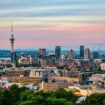 Captivating view of Auckland's skyline at dusk featuring the iconic Sky Tower under a colorful sky. Photo by Donovan Kelly, Pexels