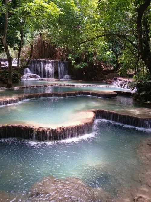 The turquoise pools and cascading falls of Kuang Si Waterfall near Luang Prabang, Laos. Photo by Shivika Singh