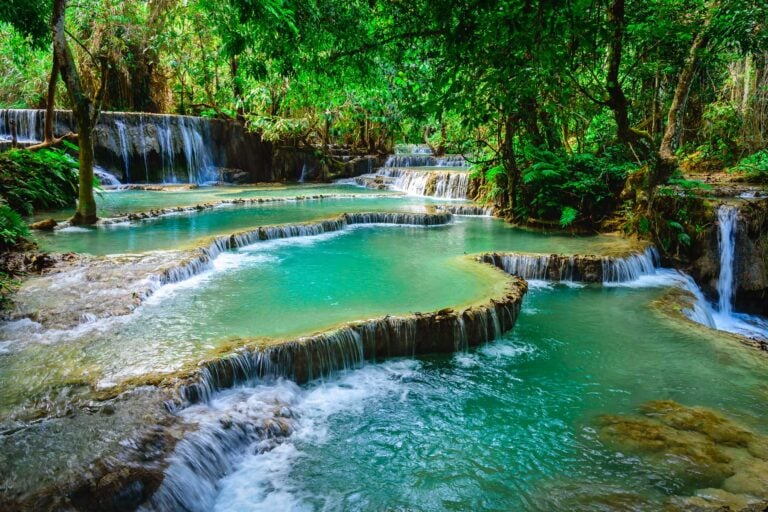 The Kuang Si waterfall is a famous destination in Laos. Photo by iStock/Torjrtrx