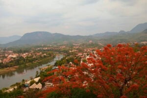 Panoramic view of Luang Prabang, Laos, with the river and surrounding mountains. Photo by Shivika Singh