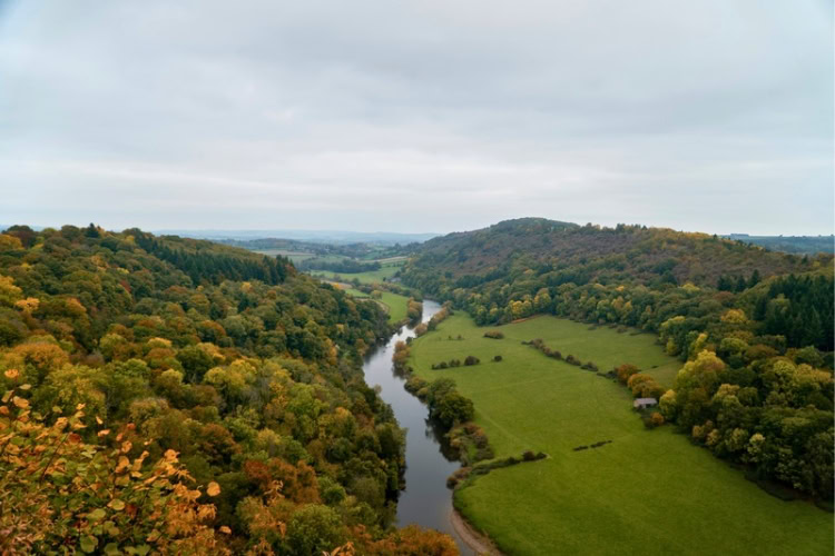The River Wye winds through the Wye Valley in autumn, England. Photo by Rob Wingate, Unsplash