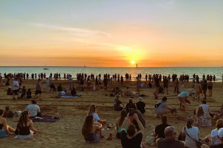 Marketgoers at Mindil Beach, Darwin, watch the sunset. Photo by Judy Barford