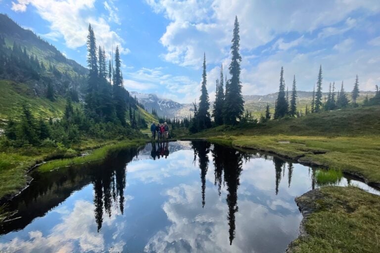 Alpine lakes mirror the Selkirk Mountains. Photo by guide, Tate