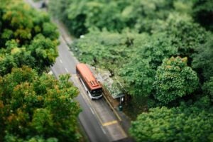 Bus at a stop from above. Photo by CHUTTERSNAP, Unsplash