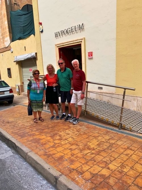 Sue Don and Brent with guide Anna in front of the Hypogeum. Photo by Jane Cassie.
