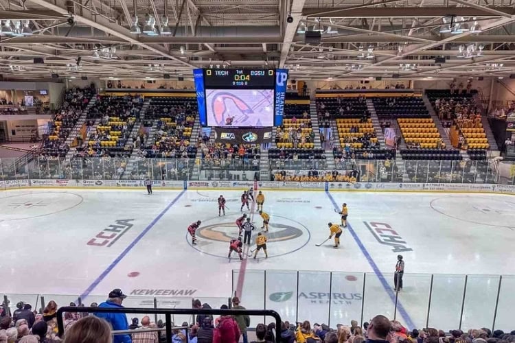 Cheering on the Huskies at Michigan Tech. Photo by Julie Suman