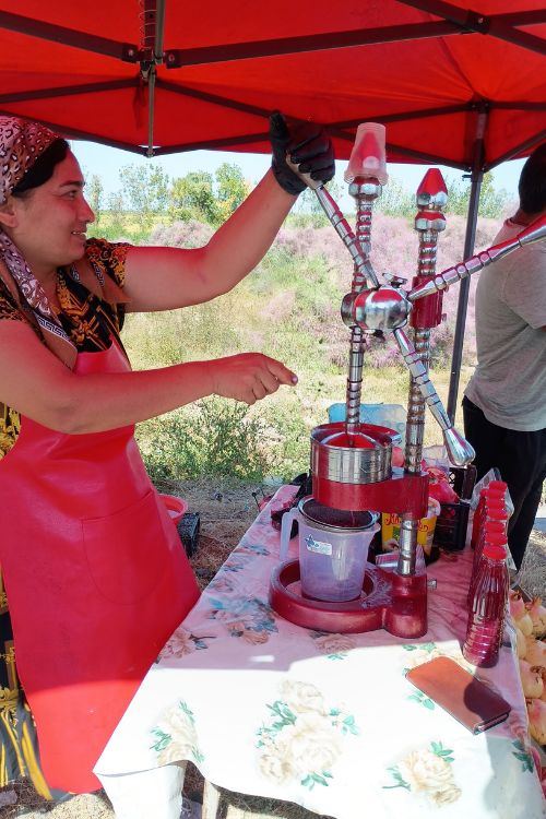 fresh pomegranate juice being squeezed