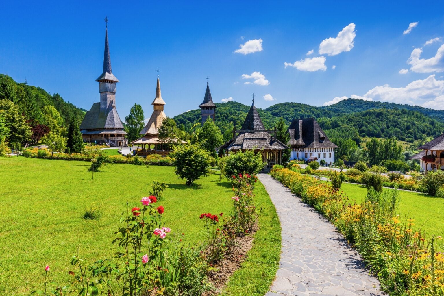 Wooden churches at Barsana Monastery in the Maramures region of Romania. Photo by SCStock via iStock